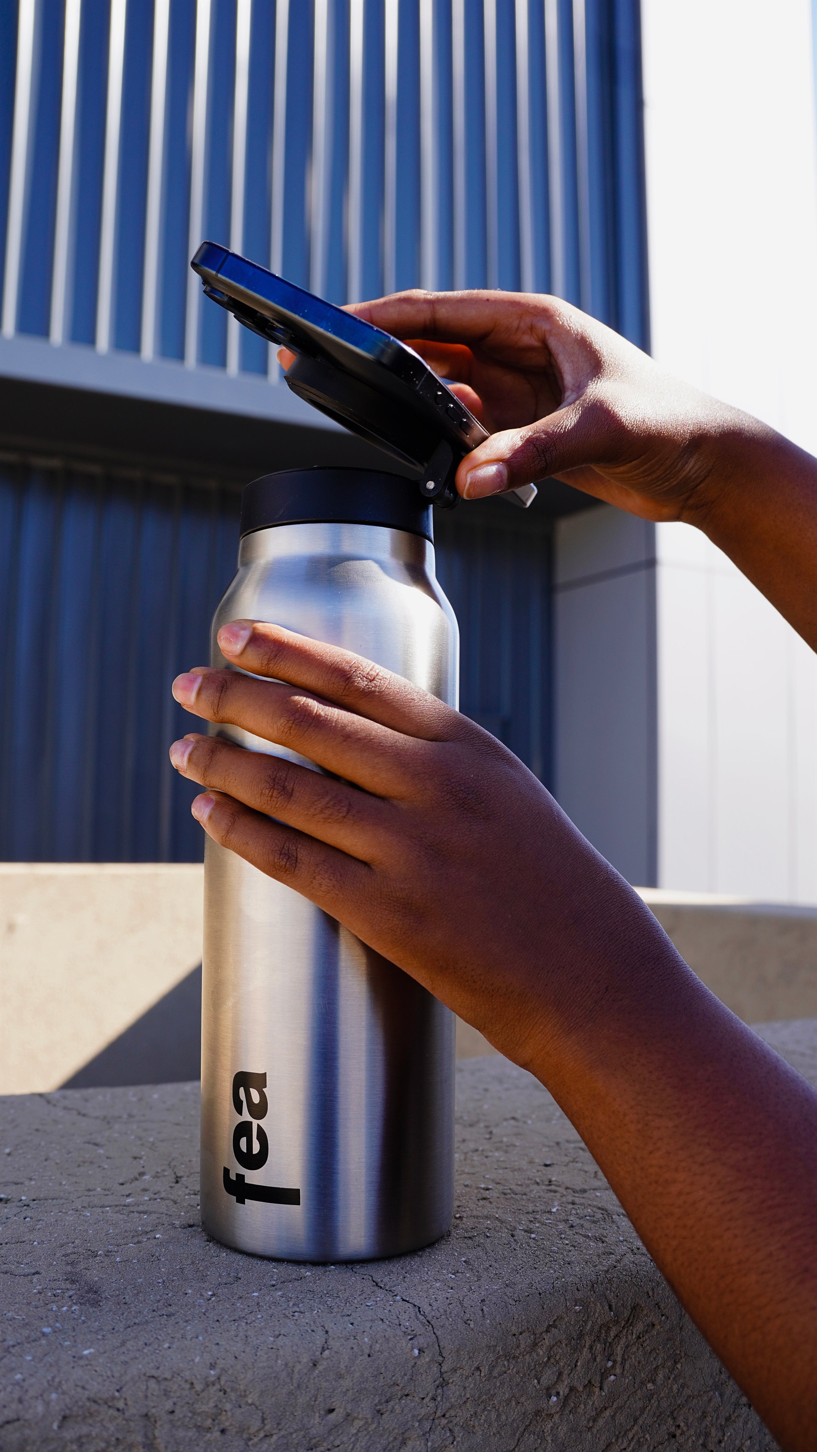 Person using water bottle
